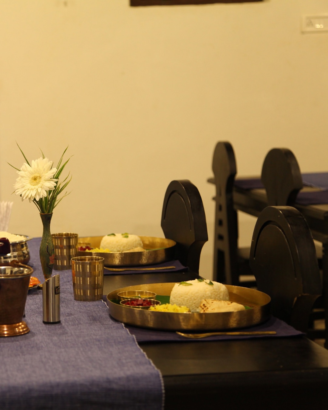 Traditional Kerala Ayurvedic meal served on a brass thali at Niramayam